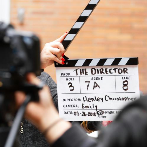 Man Holding Clapper Board